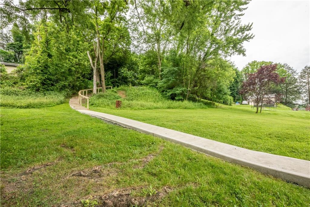 701 Main Street Irwin, PA 15642 - Photo 31 of 37 a view of a field with grass and trees