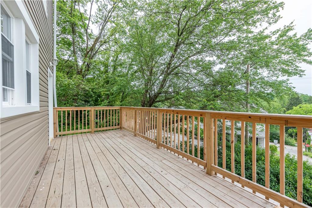 701 Main Street Irwin, PA 15642 - Photo 32 of 37 a balcony with view of trees in front of it