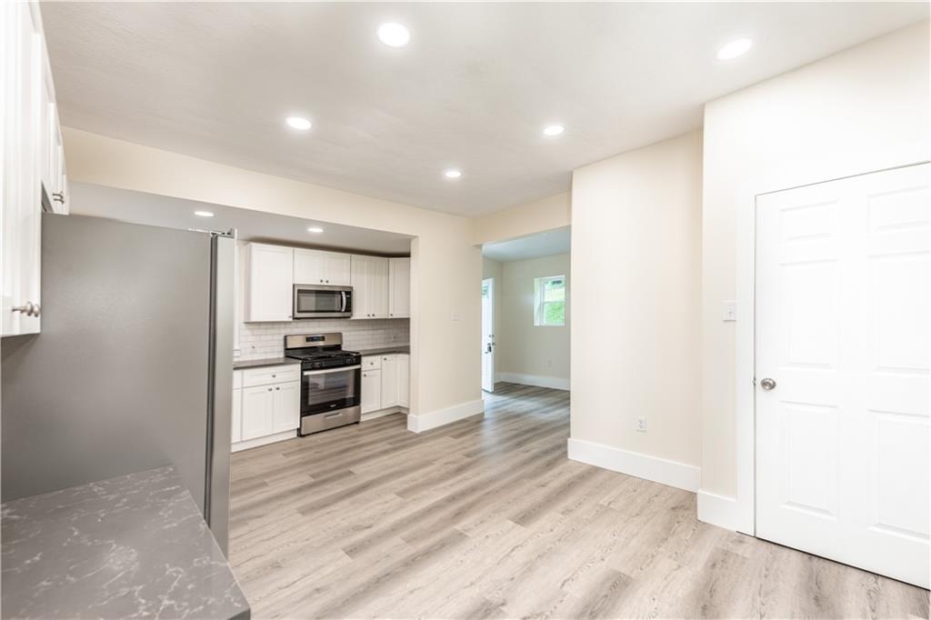 701 Main Street Irwin, PA 15642 - Photo 6 of 37 a view of kitchen with sink microwave and stove