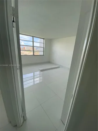 a view of empty room with windows