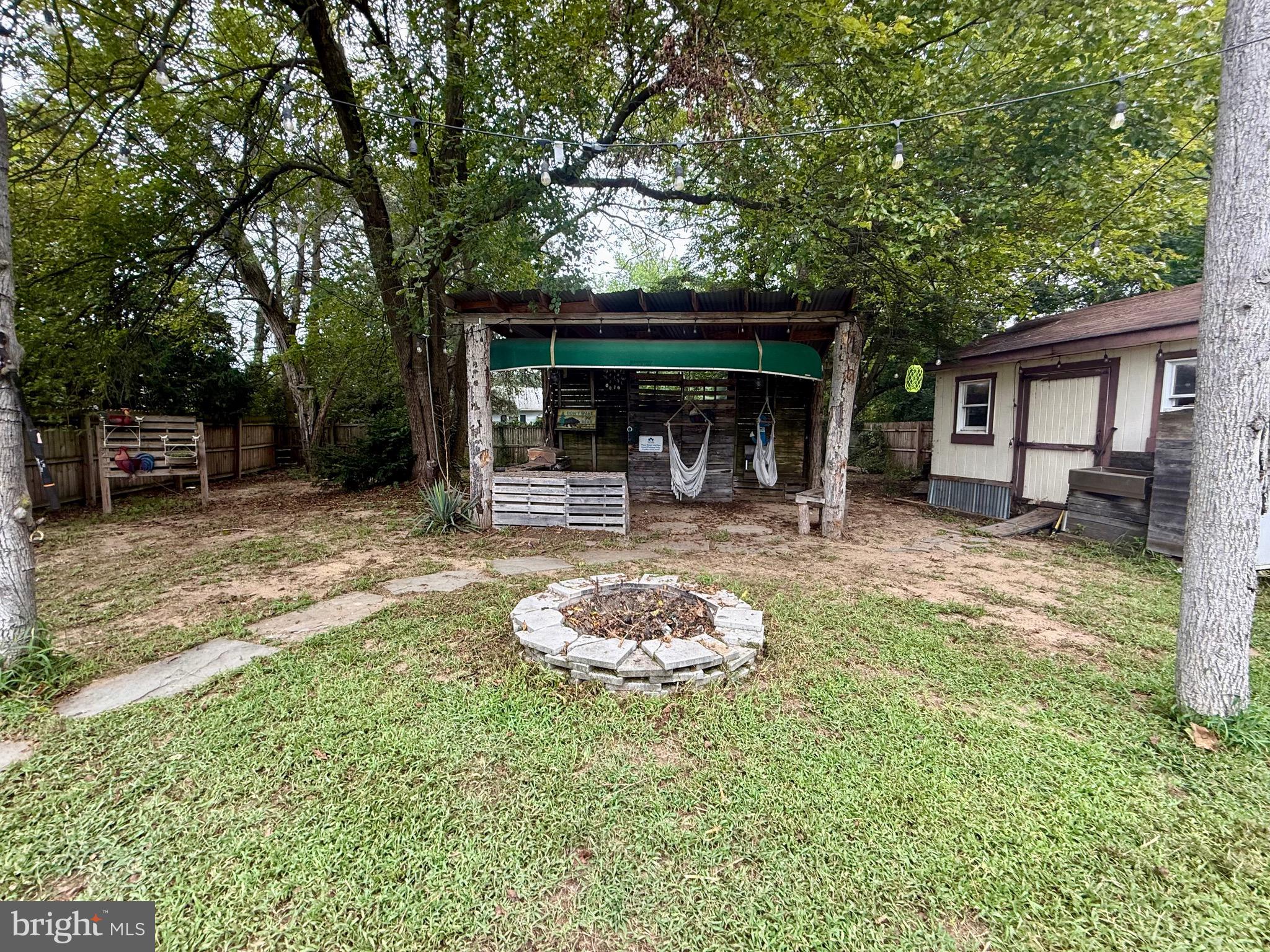218 3rd Street Crumpton, MD 21628 - Photo 8 of 12 a front view of a house with a yard garage and outdoor seating