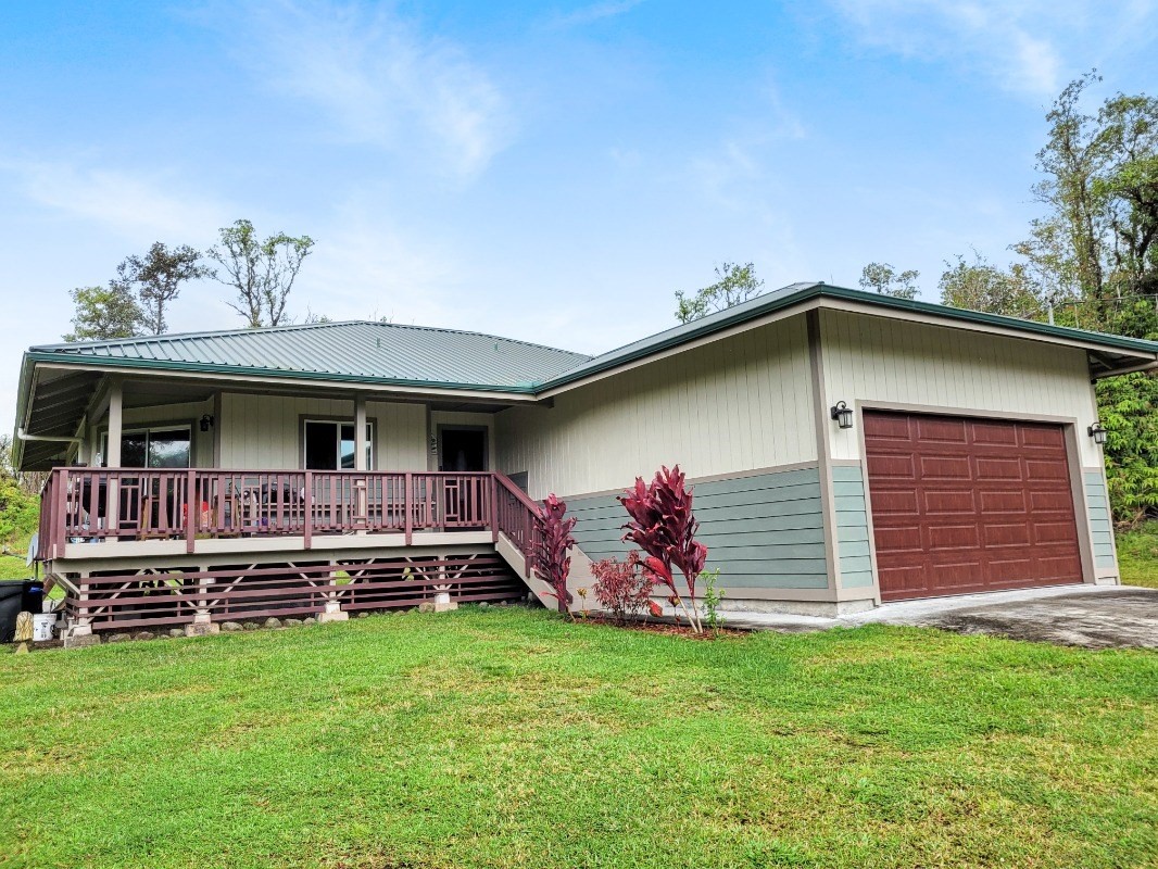 18-8079 North Kulani Road Mountain View, HI 96771 - Photo 1 of 27 a view of a house with a yard