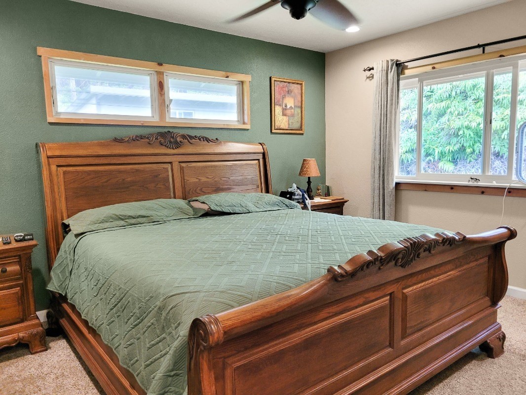 18-8079 North Kulani Road Mountain View, HI 96771 - Photo 11 of 27 a bedroom with a bed and window