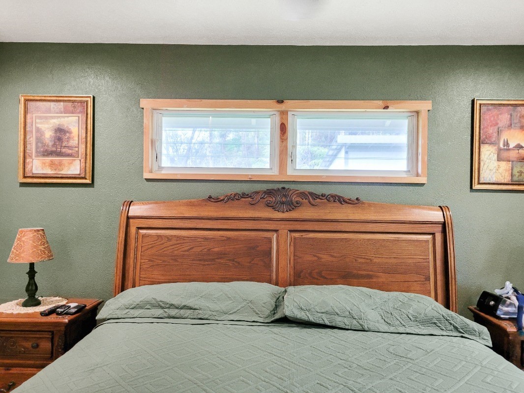 18-8079 North Kulani Road Mountain View, HI 96771 - Photo 12 of 27 a bedroom with a bed and a dresser