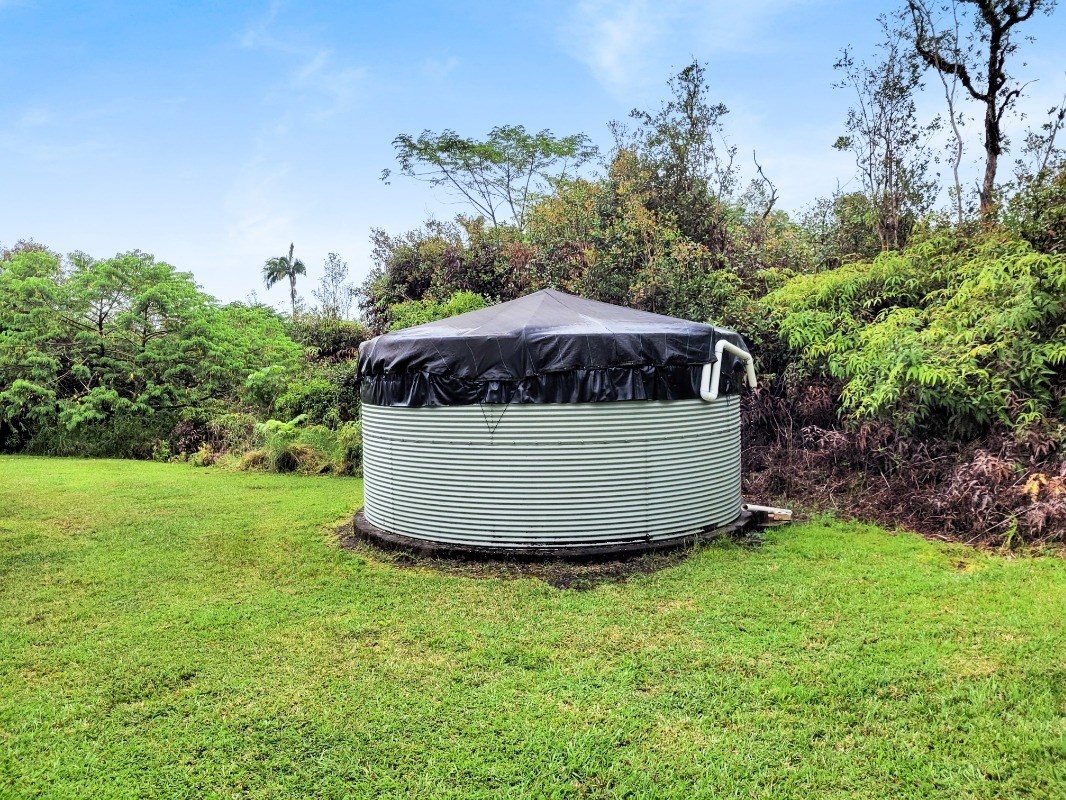 18-8079 North Kulani Road Mountain View, HI 96771 - Photo 25 of 27 a view of a backyard with a garden