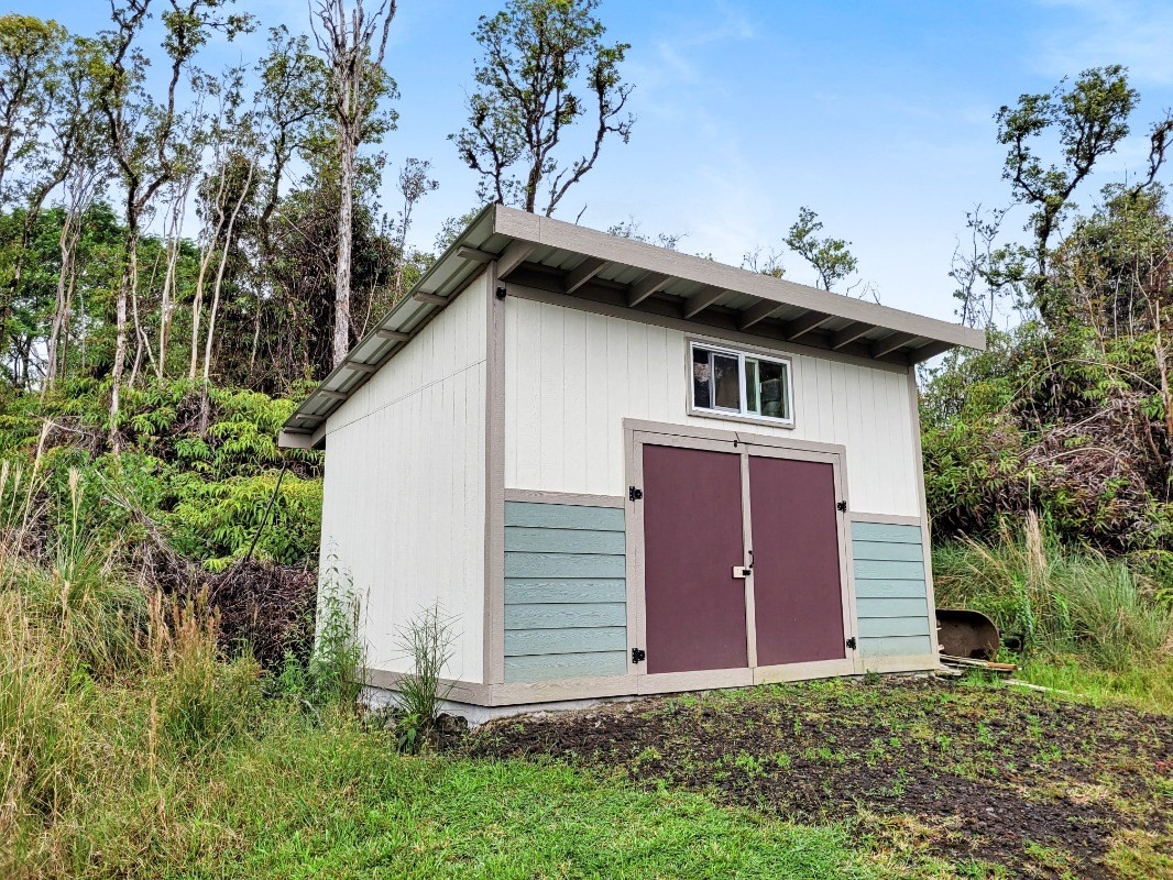 18-8079 North Kulani Road Mountain View, HI 96771 - Photo 26 of 27 a view of a house with a yard