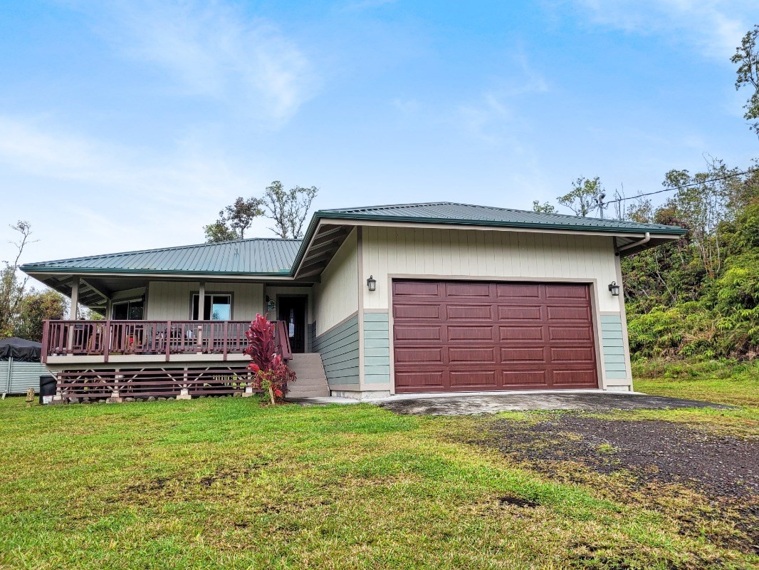 18-8079 North Kulani Road Mountain View, HI 96771 - Photo 27 of 27 a front view of a house with a yard