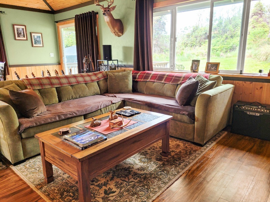 18-8079 North Kulani Road Mountain View, HI 96771 - Photo 4 of 27 a living room with furniture and a large window