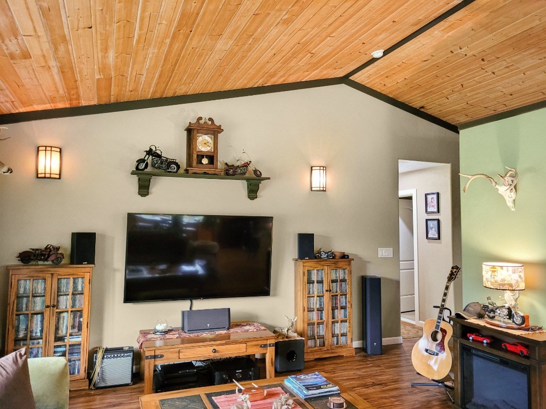 18-8079 North Kulani Road Mountain View, HI 96771 - Photo 6 of 27 a living room with furniture and a flat screen tv