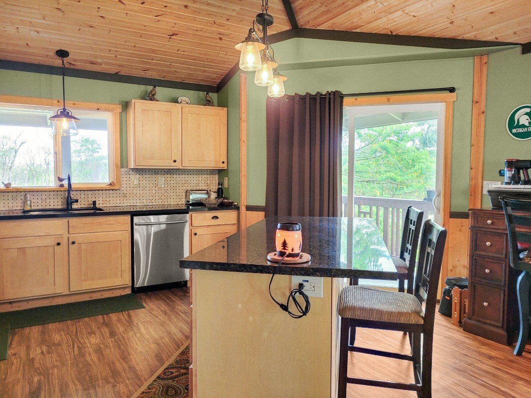 18-8079 North Kulani Road Mountain View, HI 96771 - Photo 7 of 27 a kitchen with a window a sink and cabinets