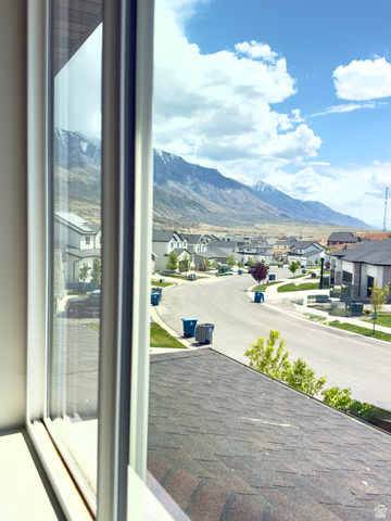 1823 South Longview Road Santaquin, UT 84655 - Photo 66 of 69 Window framing a mountainous backdrop and residential streetscape