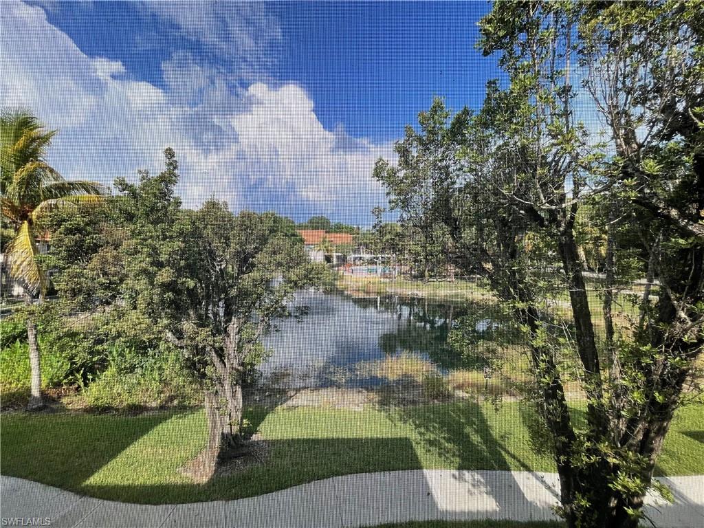 2142 Arbour Walk Circle, Unit 2624 Naples, FL 34109 - Photo 11 of 13 a view of a yard
