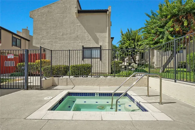 a white bench sitting in front of a building