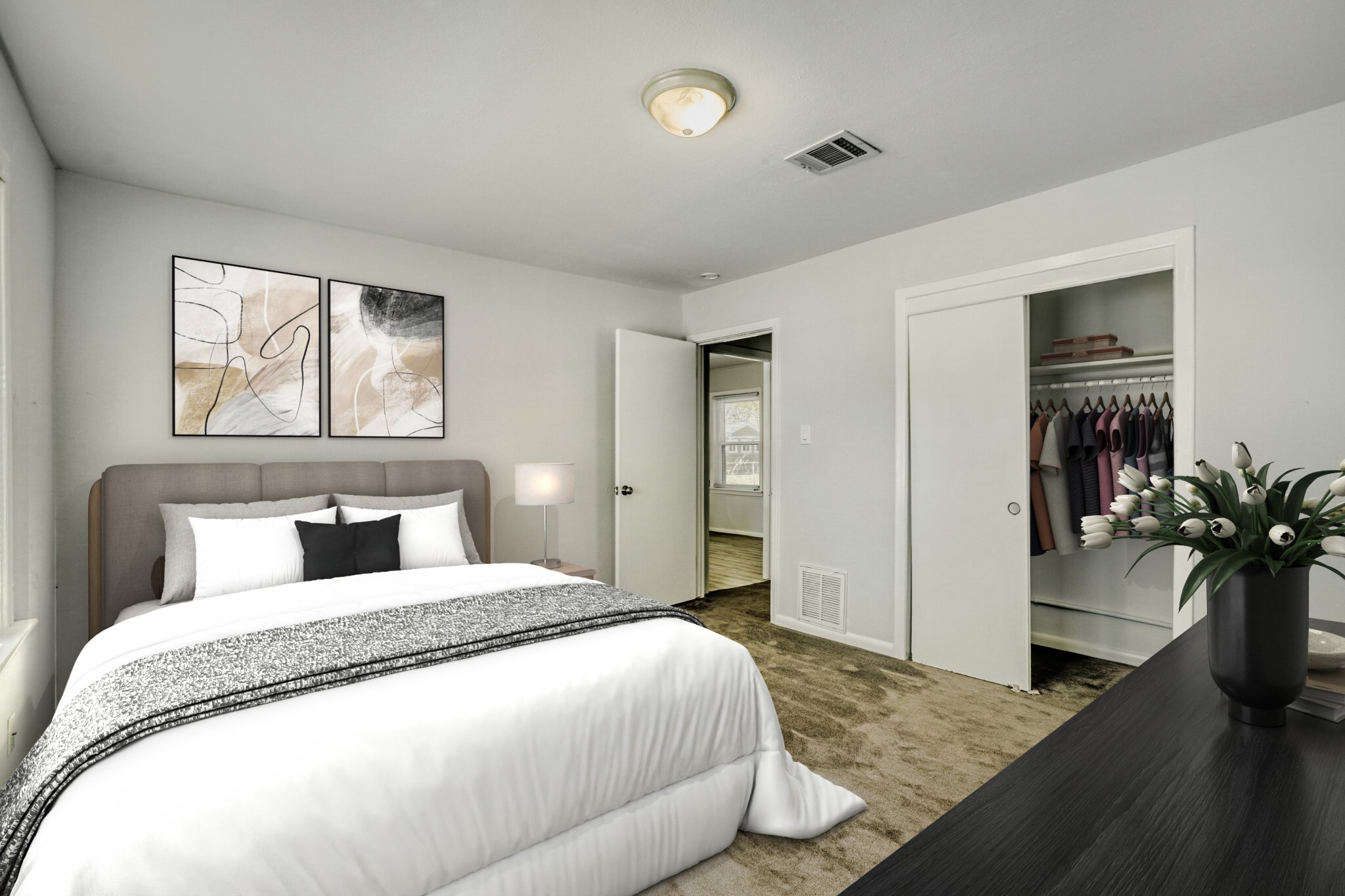 5014 Viking Drive Houston, TX 77092 - Photo 12 of 30 a bedroom with a large bed and a potted plant