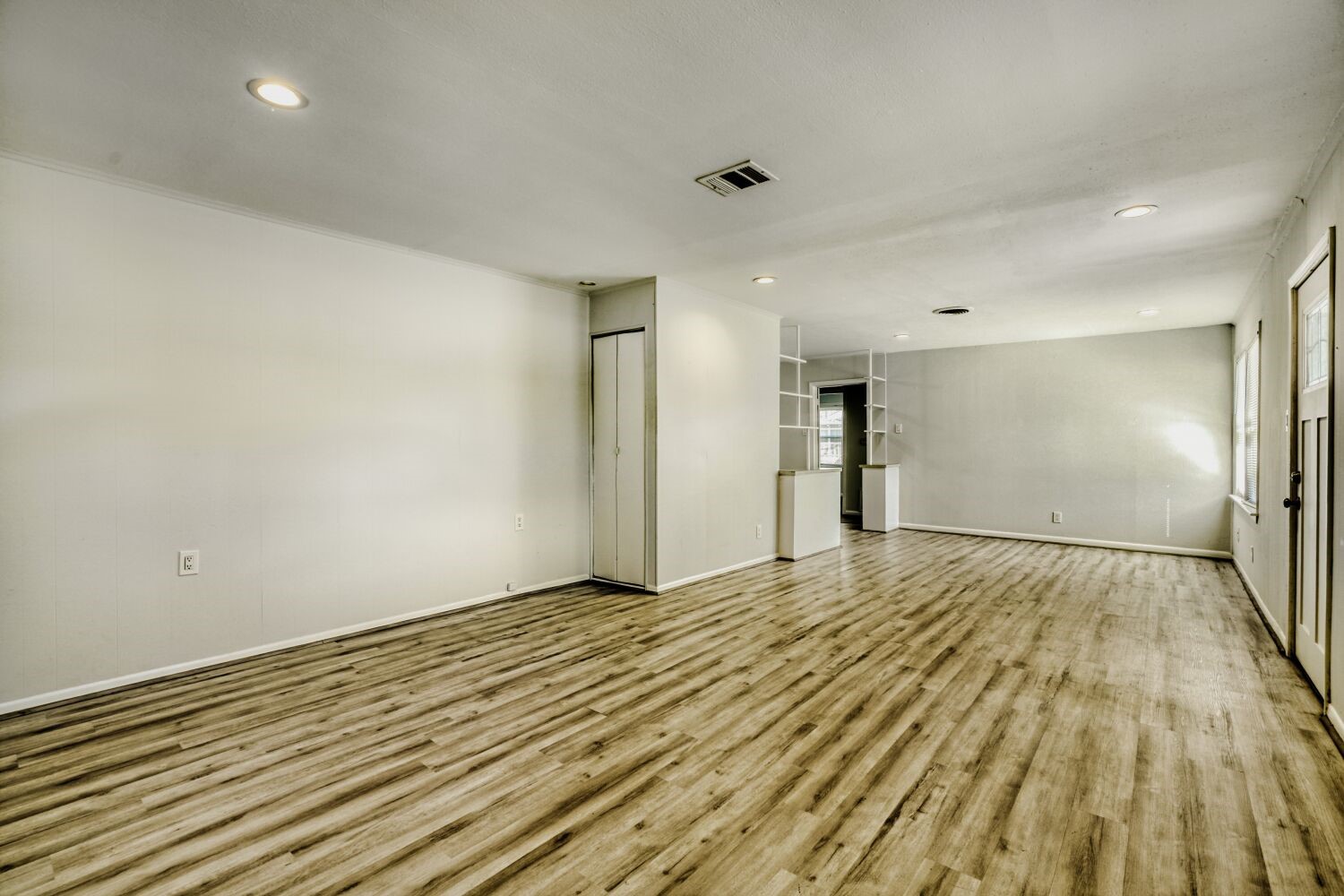5014 Viking Drive Houston, TX 77092 - Photo 8 of 30 a view of an empty room and wooden floor