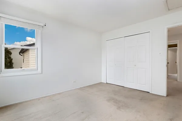 a livingroom with furniture and a large window