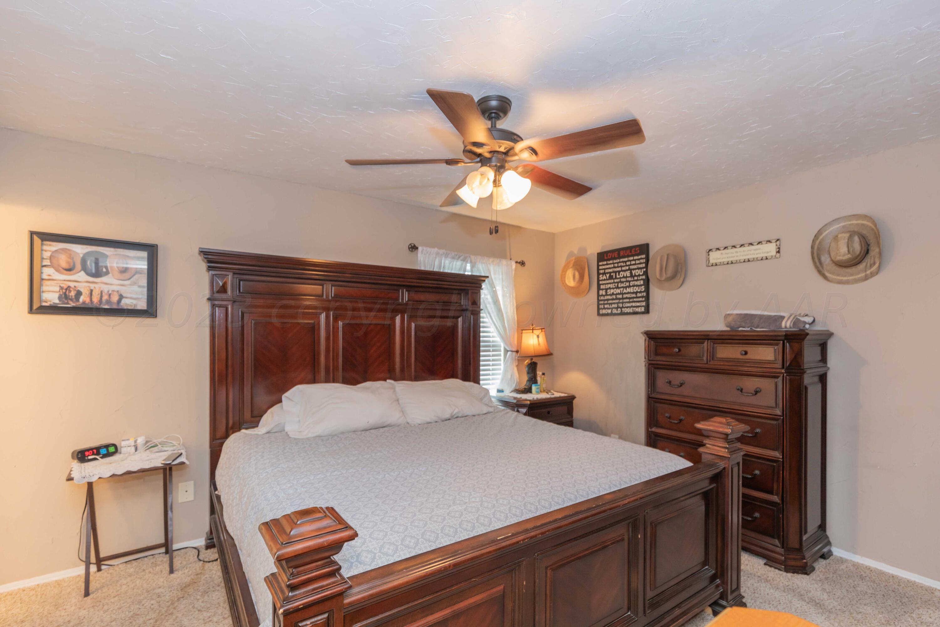2805 Shield Court Amarillo, TX 79110 - Photo 14 of 36 a bed room with a bed and a television
