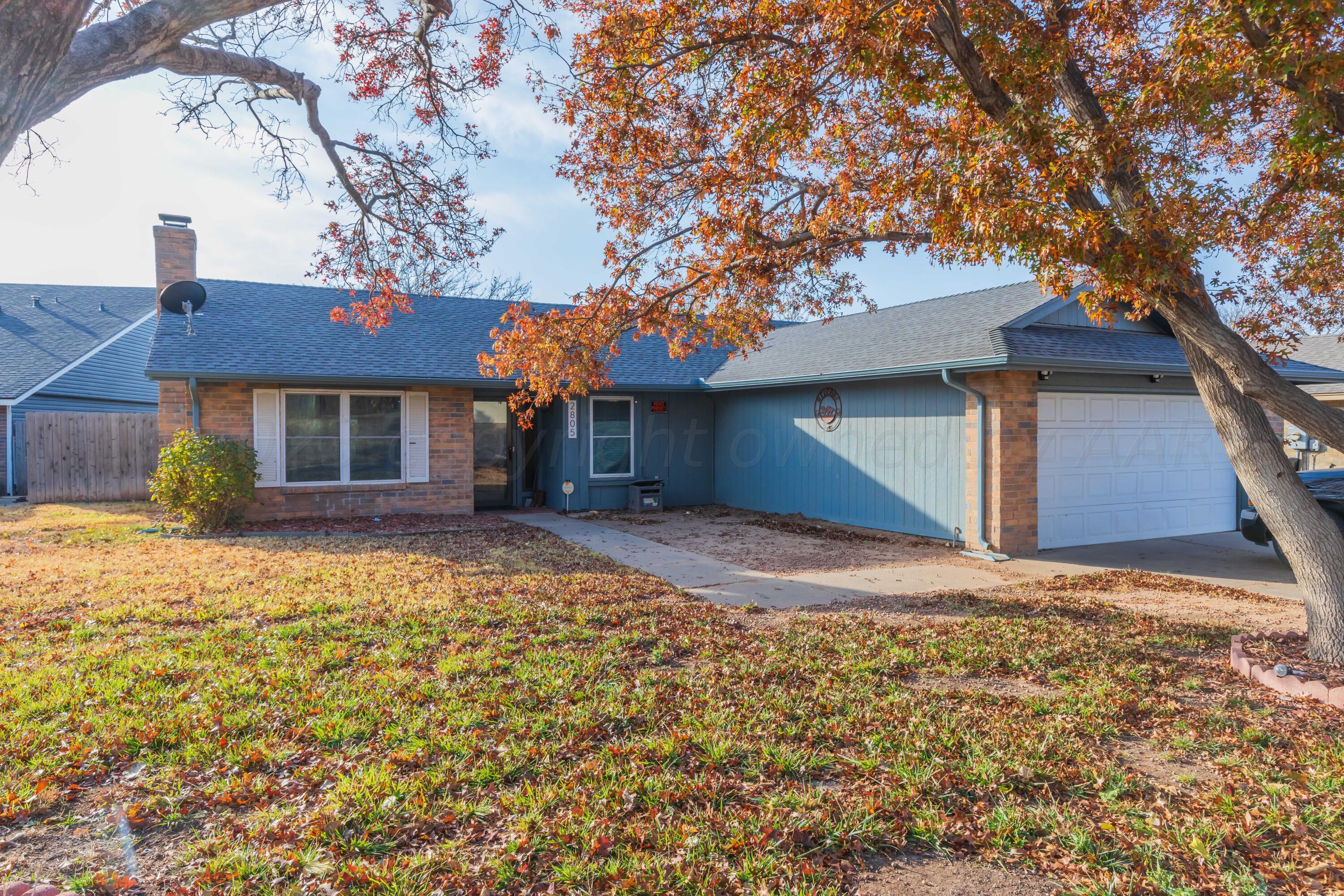 2805 Shield Court Amarillo, TX 79110 - Photo 2 of 36 a house with trees in front of it