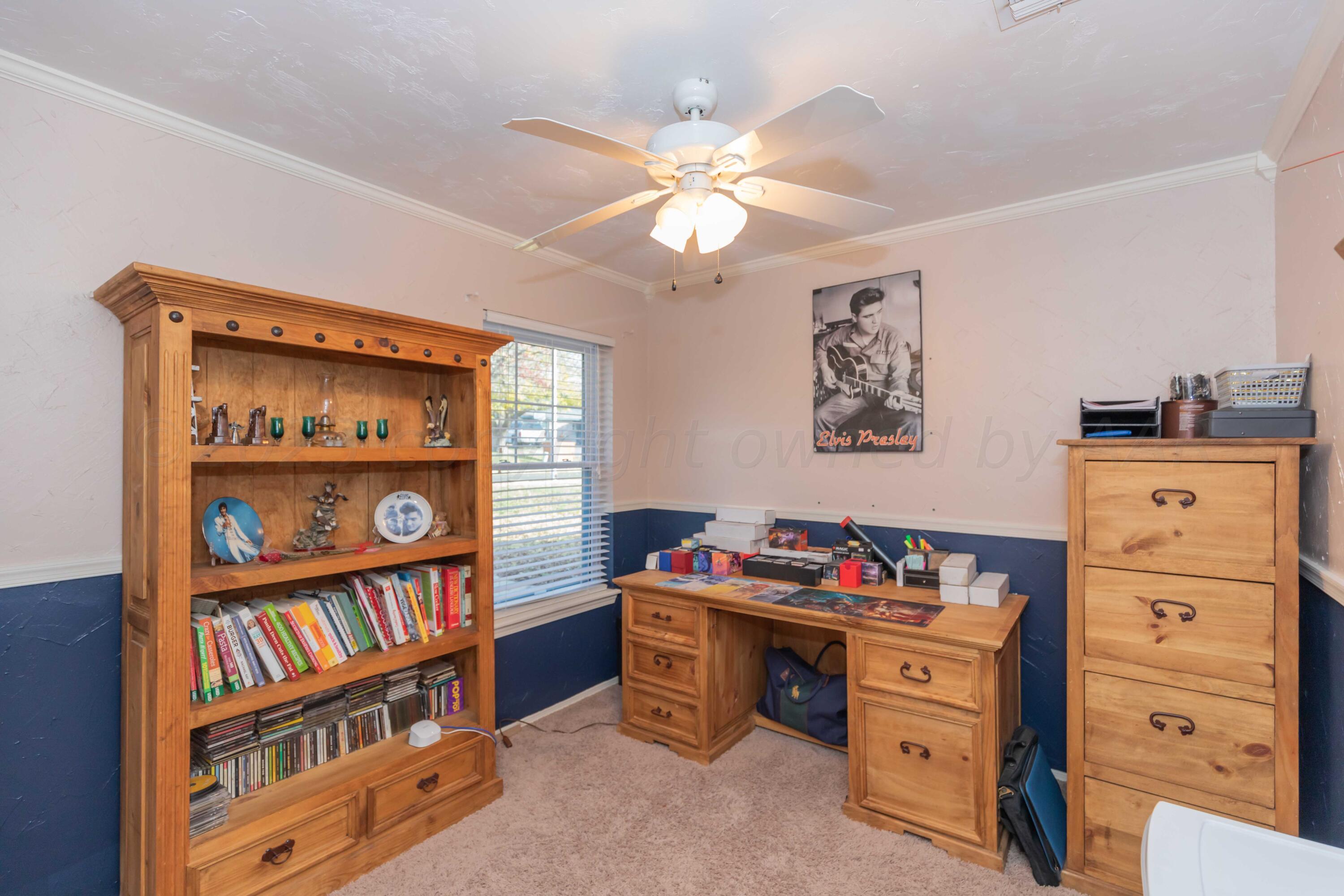 2805 Shield Court Amarillo, TX 79110 - Photo 26 of 36 a bedroom with a bed and a book shelf