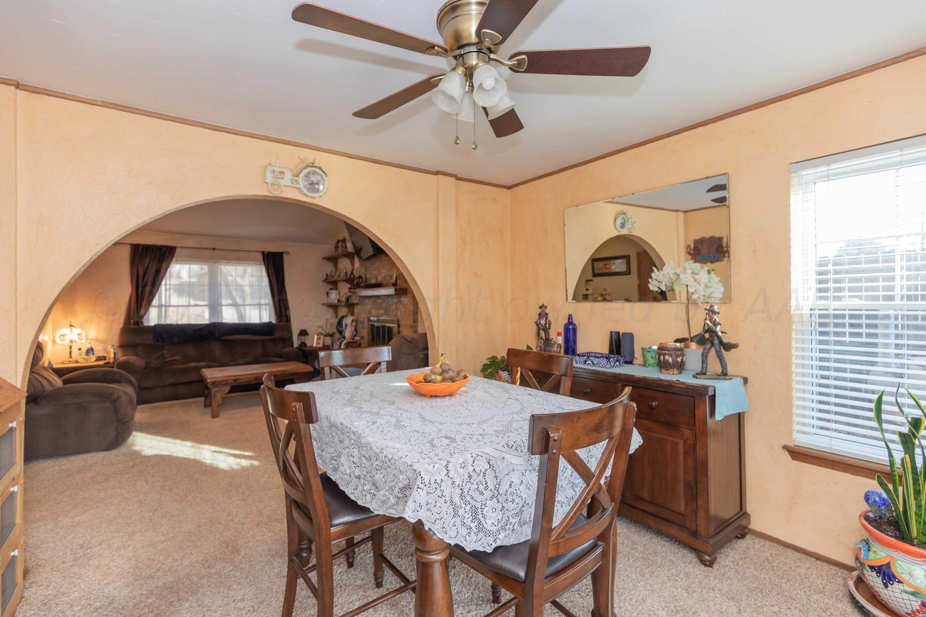 2805 Shield Court Amarillo, TX 79110 - Photo 8 of 36 a dining room with furniture and window