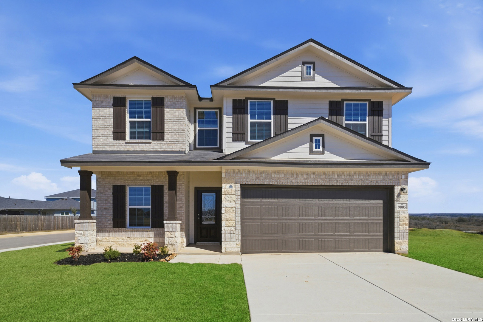 9005 Hazel Birch Elmendorf, TX 78112 - Photo 1 of 1 a front view of a house with a yard and garage