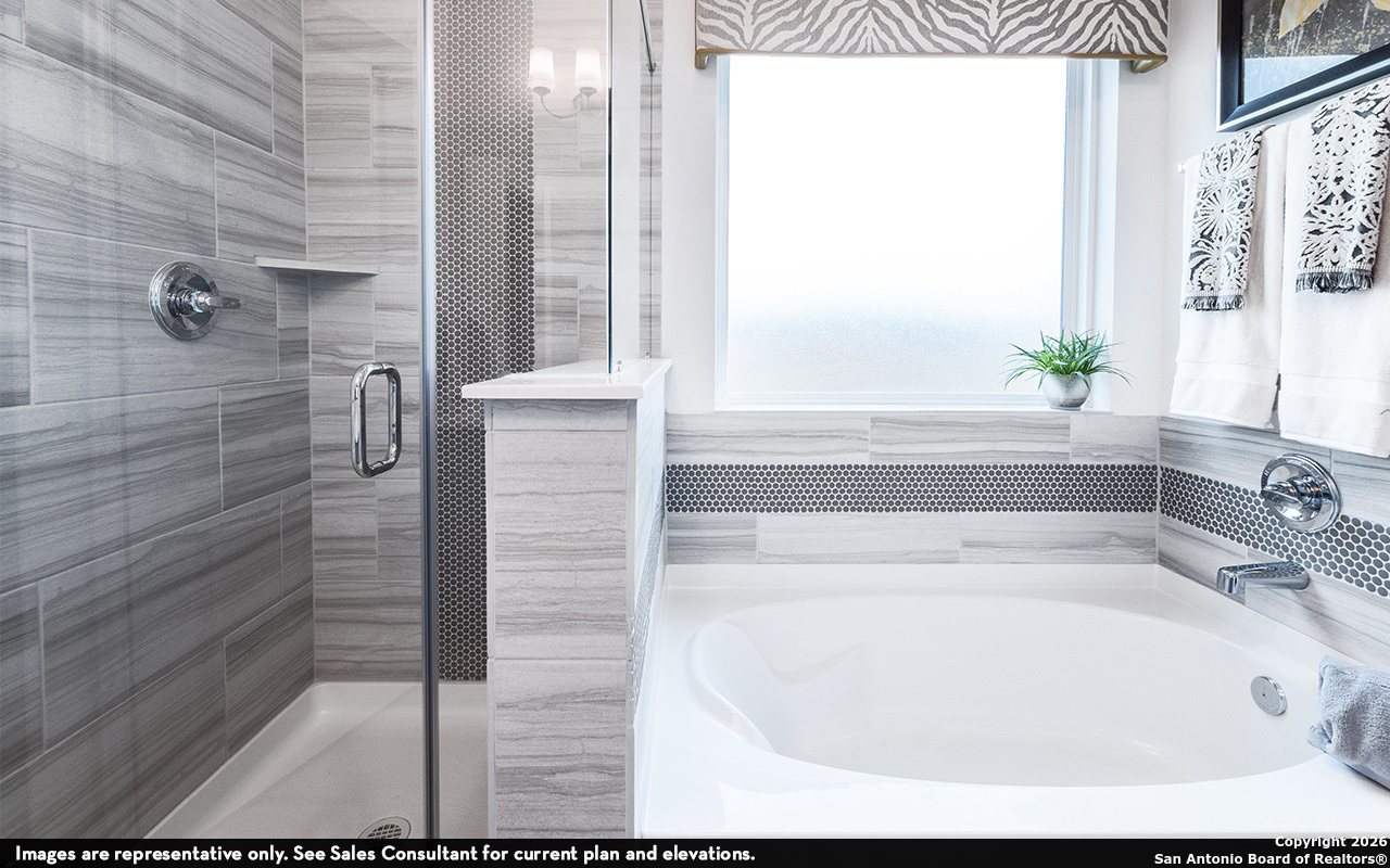 9005 Hazel Birch Elmendorf, TX 78112 - Photo 15 of 21 a bathroom with bathtub and window