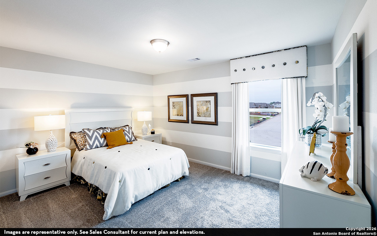 9005 Hazel Birch Elmendorf, TX 78112 - Photo 19 of 21 a bedroom with a bed and a view of bathroom