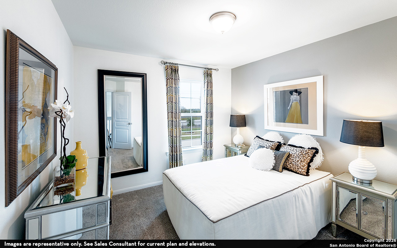 9005 Hazel Birch Elmendorf, TX 78112 - Photo 21 of 21 a bedroom with a bed and a flat screen tv