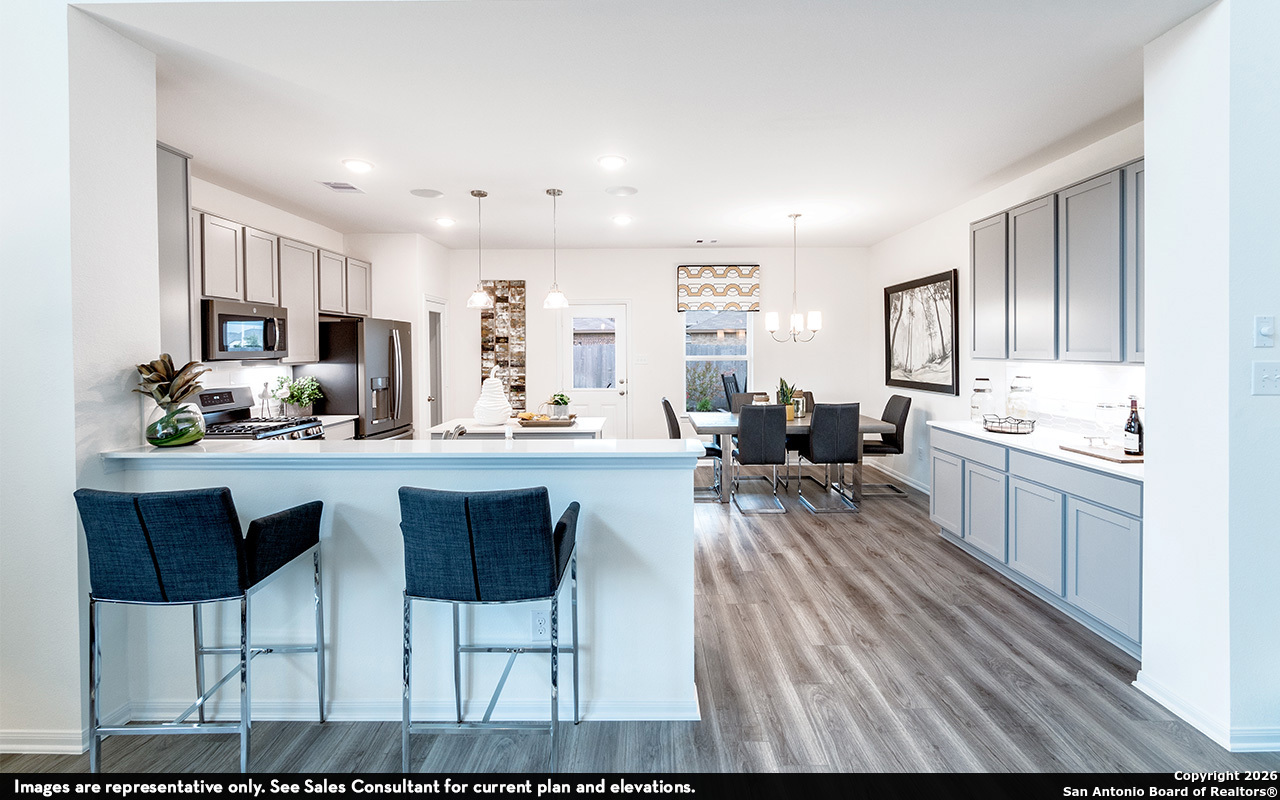 9005 Hazel Birch Elmendorf, TX 78112 - Photo 6 of 21 a living room with stainless steel appliances kitchen island granite countertop furniture and a kitchen view