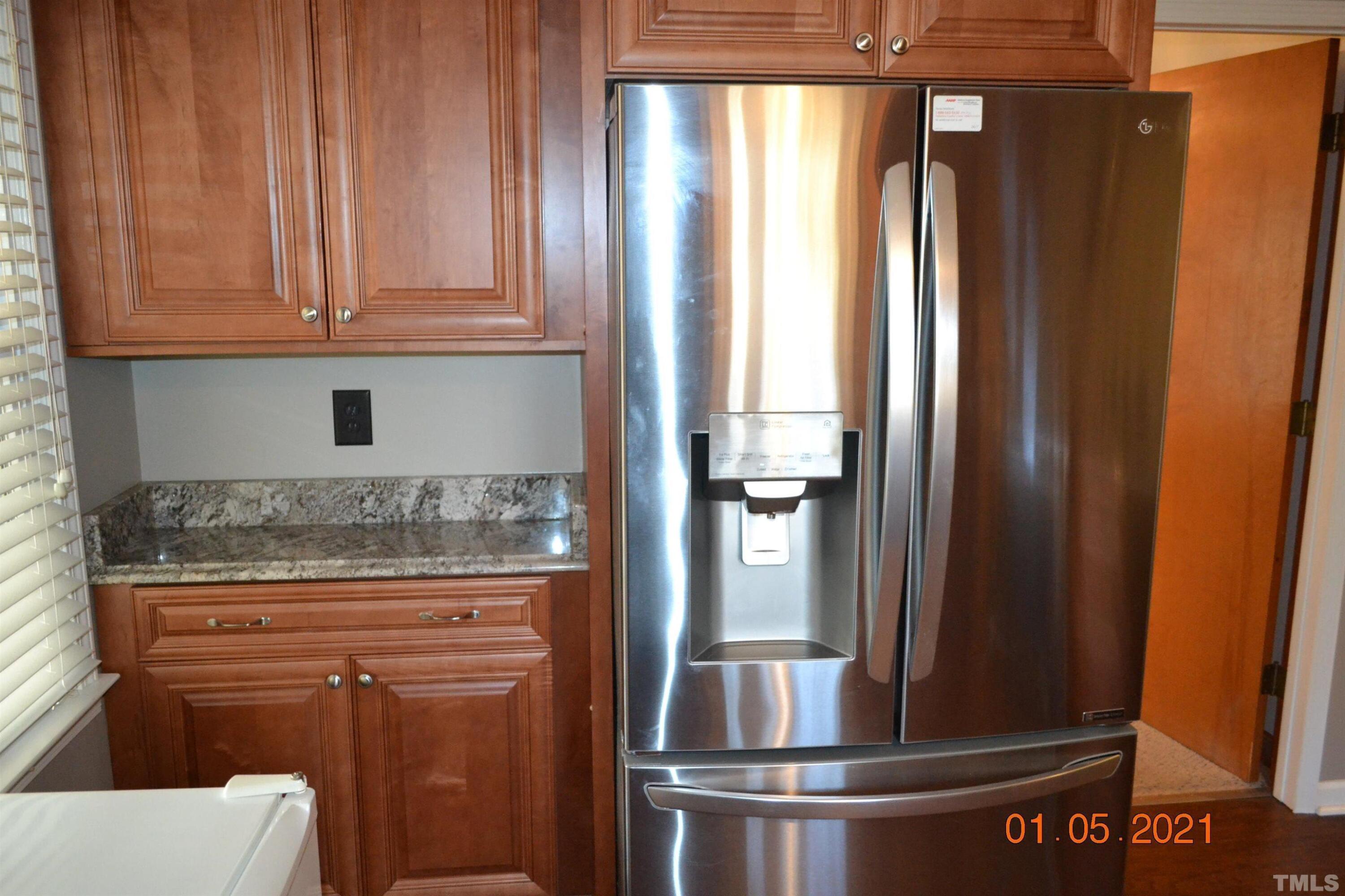 2015 Piney Plains Road Cary, NC 27518 - Photo 13 of 27 a kitchen with granite countertop stainless steel appliances and cabinets