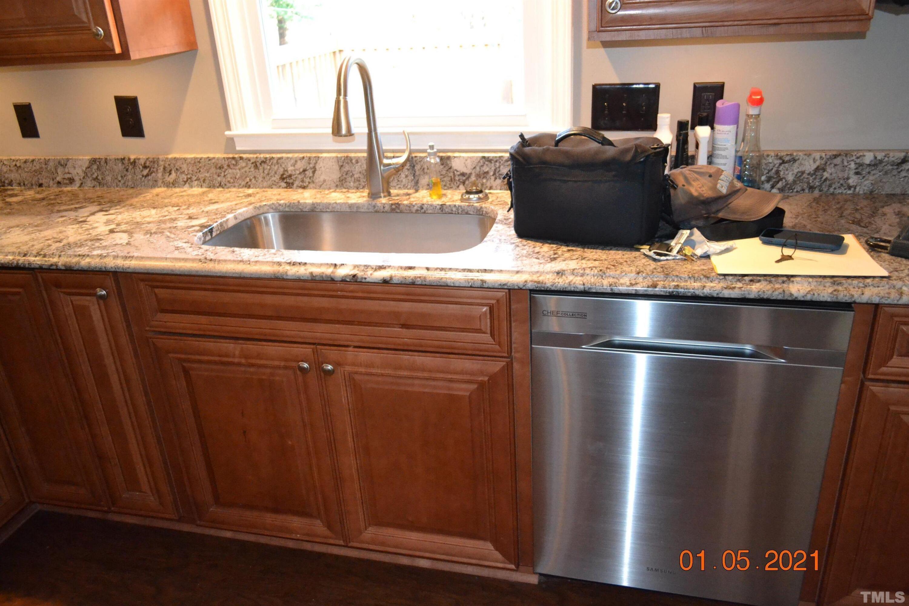 2015 Piney Plains Road Cary, NC 27518 - Photo 14 of 27 a kitchen with a refrigerator and sink