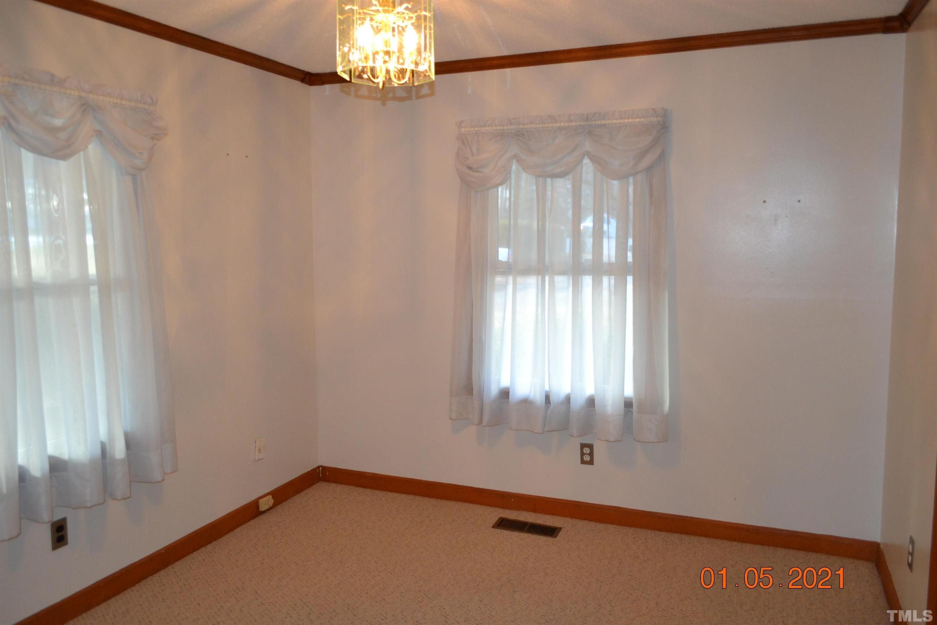 2015 Piney Plains Road Cary, NC 27518 - Photo 18 of 27 a view of an empty room with a window