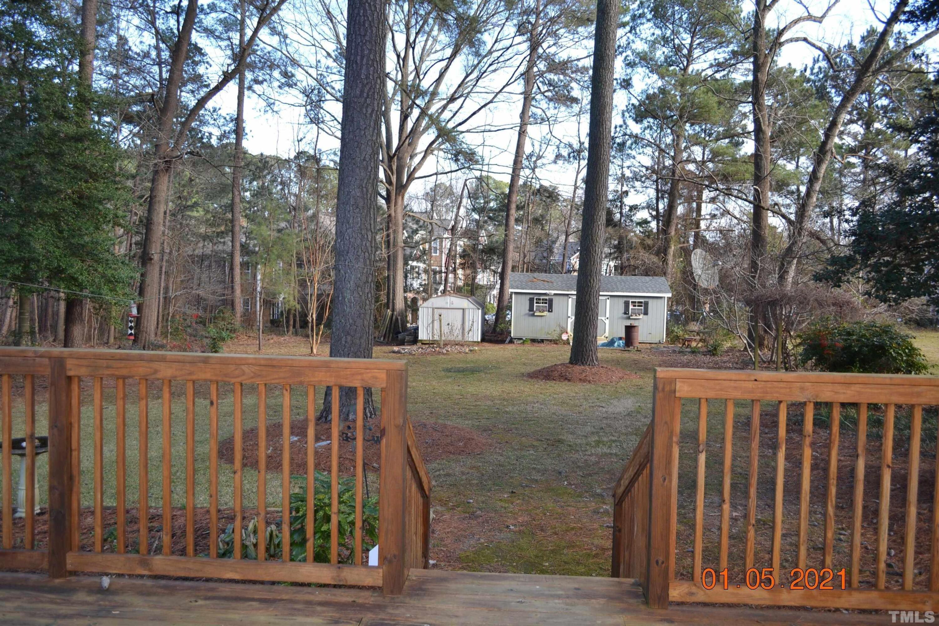2015 Piney Plains Road Cary, NC 27518 - Photo 9 of 27 a view of a house with a wooden fence
