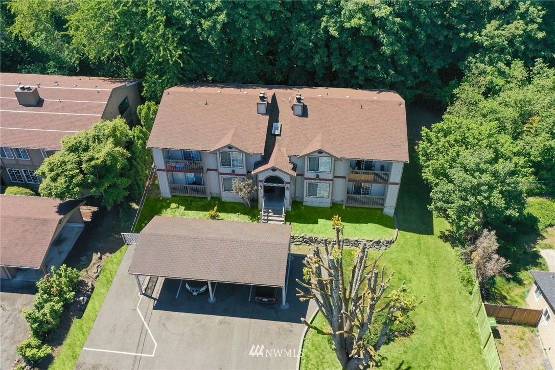 3118 Morrison Road West, Unit AD University Place, WA 98466 - Photo 1 of 11 an aerial view of a house with swimming pool and garden