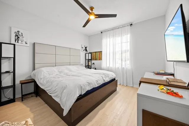 a bedroom with a bed and window