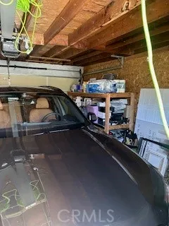 a view of parking garage with cars