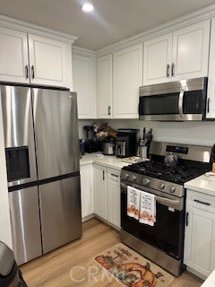 23435 Panama Avenue Carson, CA 90745 - Photo 2 of 22 a kitchen with a stove microwave and refrigerator
