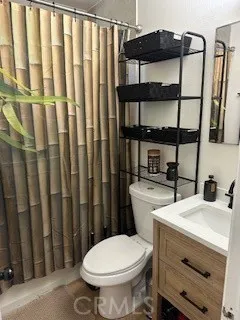 a bathroom with a toilet a sink and a shower