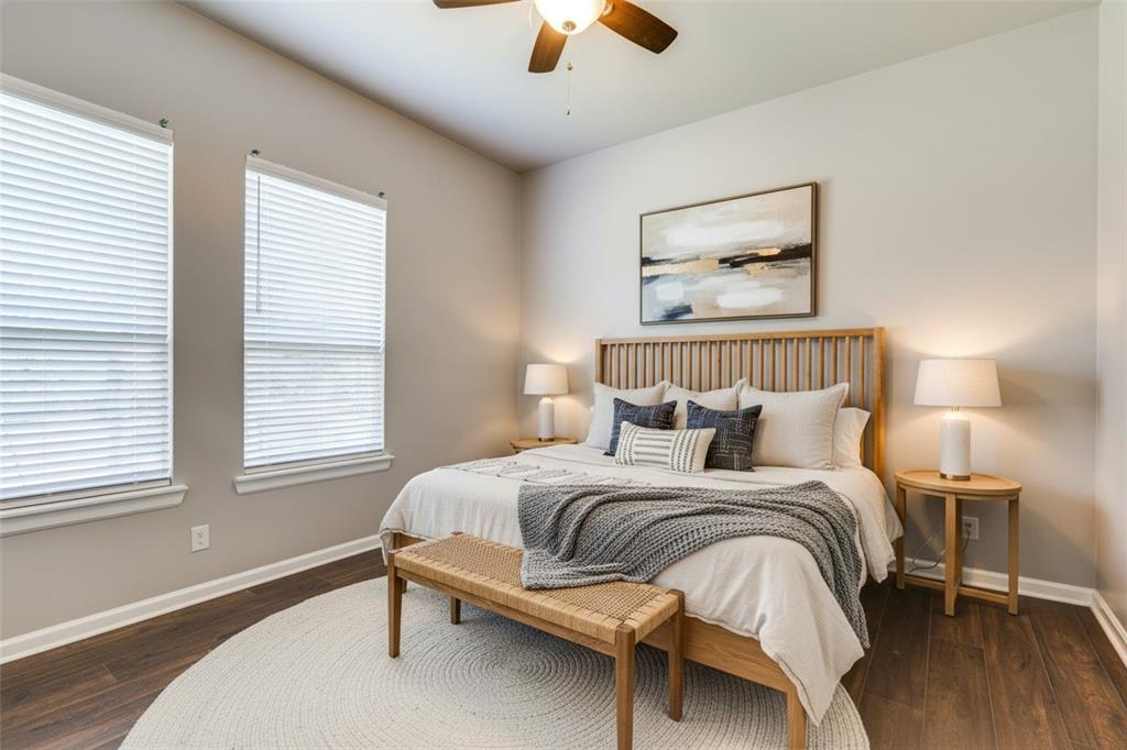 619 Buckalew Street Dallas, TX 75208 - Photo 12 of 29 a bedroom with a bed and a chandelier