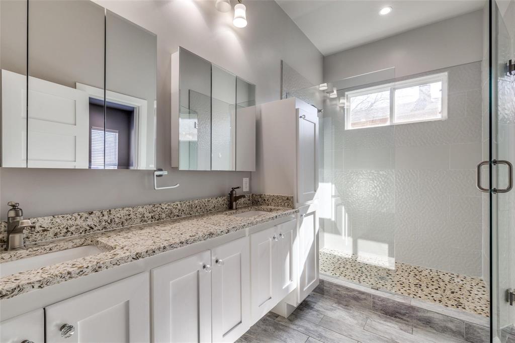 619 Buckalew Street Dallas, TX 75208 - Photo 17 of 29 a bathroom with a granite countertop sink and a mirror