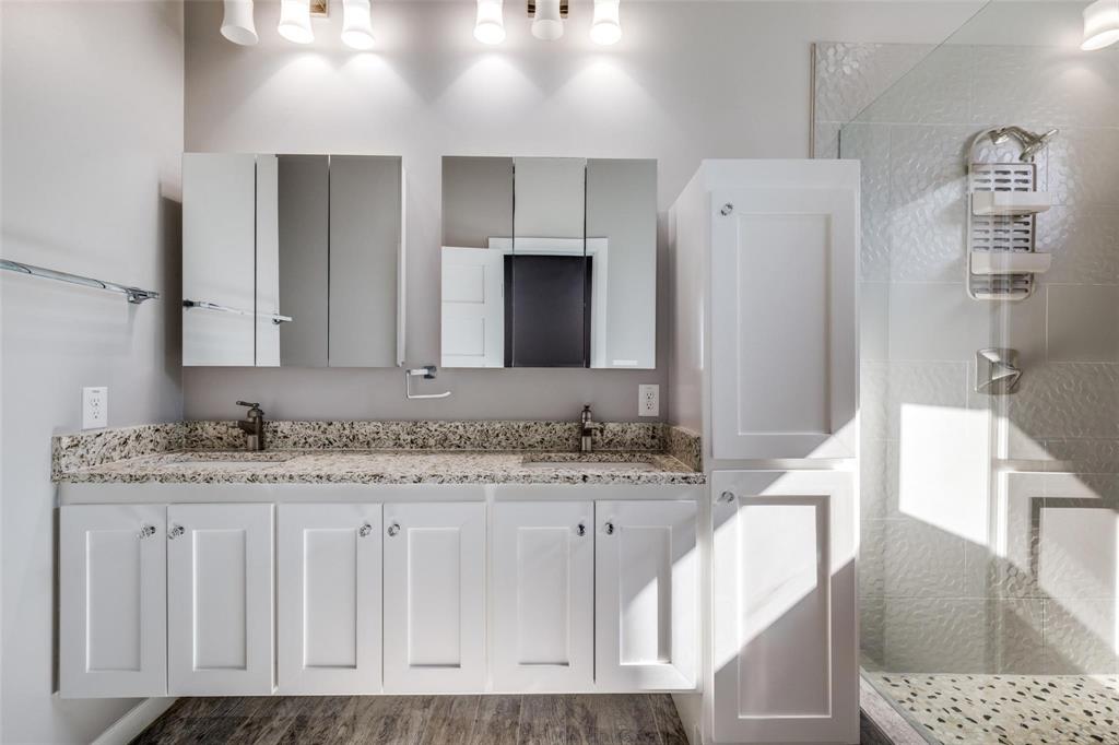 619 Buckalew Street Dallas, TX 75208 - Photo 18 of 29 a bathroom with a granite countertop sink and a mirror