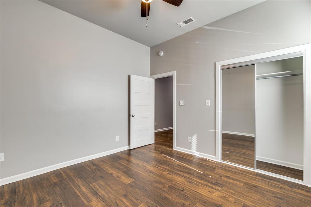 619 Buckalew Street Dallas, TX 75208 - Photo 19 of 29 a view of an empty room with wooden floor