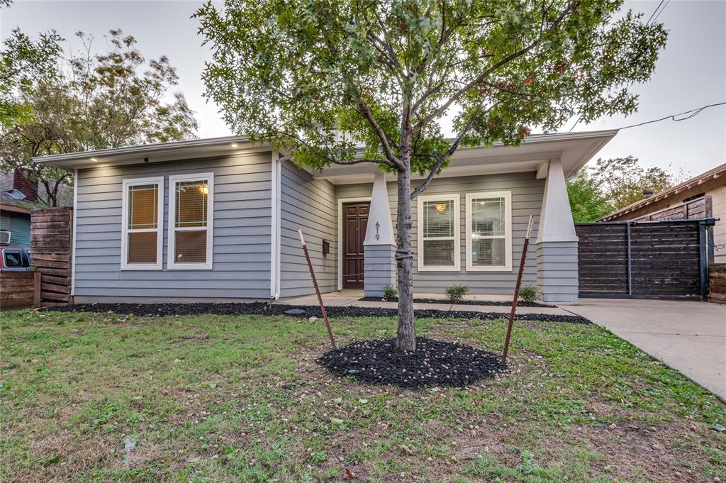 619 Buckalew Street Dallas, TX 75208 - Photo 2 of 29 a front view of a house with a garden
