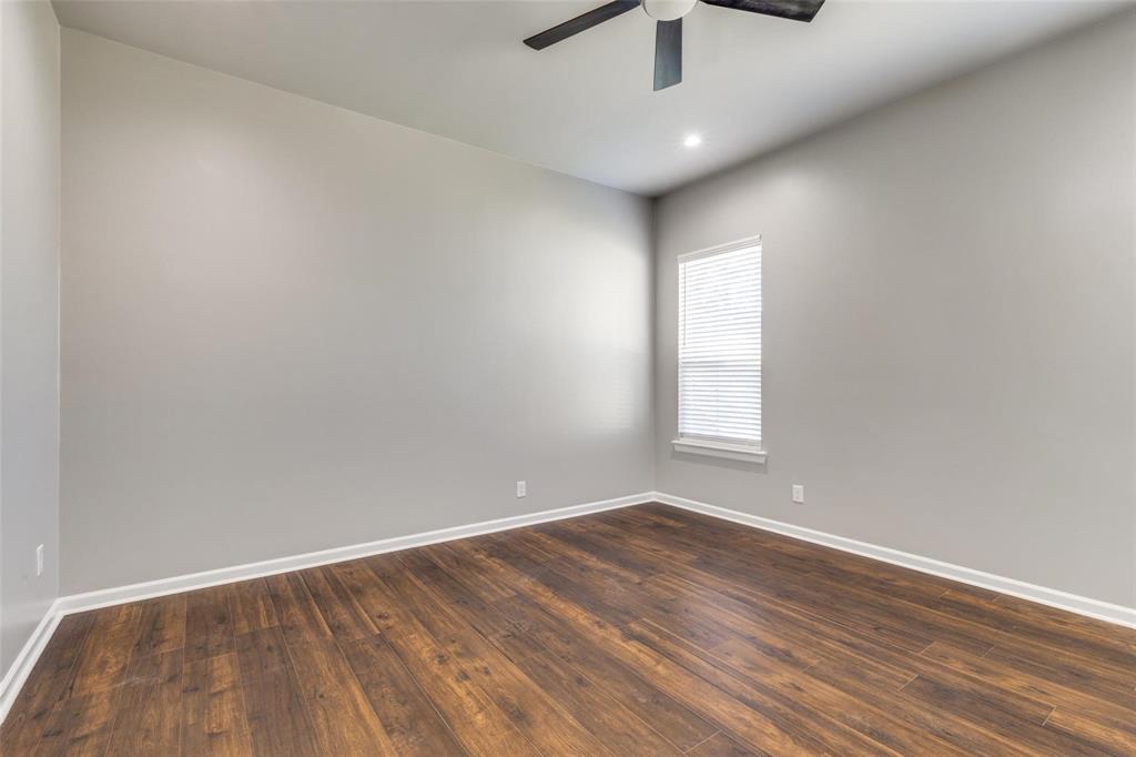 619 Buckalew Street Dallas, TX 75208 - Photo 21 of 29 wooden floor in an empty room with a window