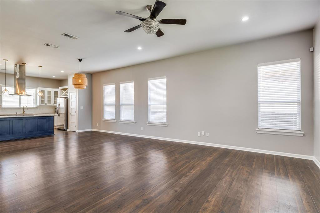 619 Buckalew Street Dallas, TX 75208 - Photo 29 of 29 a view of an empty room with a window and wooden floor