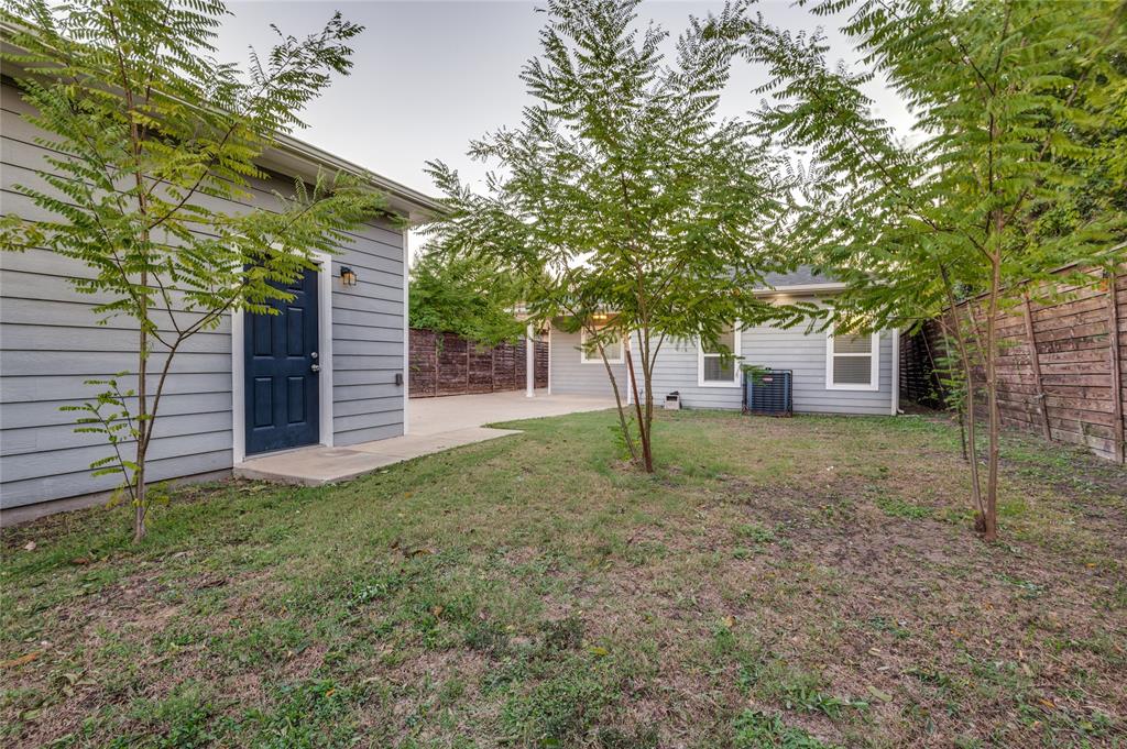 619 Buckalew Street Dallas, TX 75208 - Photo 8 of 29 a view of a house with a yard