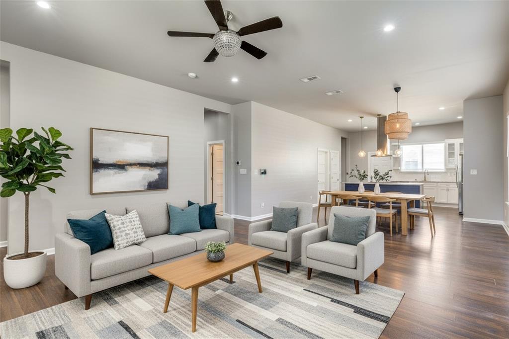 619 Buckalew Street Dallas, TX 75208 - Photo 9 of 29 a living room with furniture and a view of kitchen