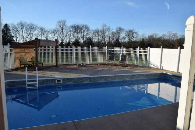 888 Locust Grove Road Watertown, TN 37184 - Photo 15 of 20 32x16 in-ground pool is surrounded by privacy fencing on the sides and decorative fencing to rear for an unimpeded view of the countryside.