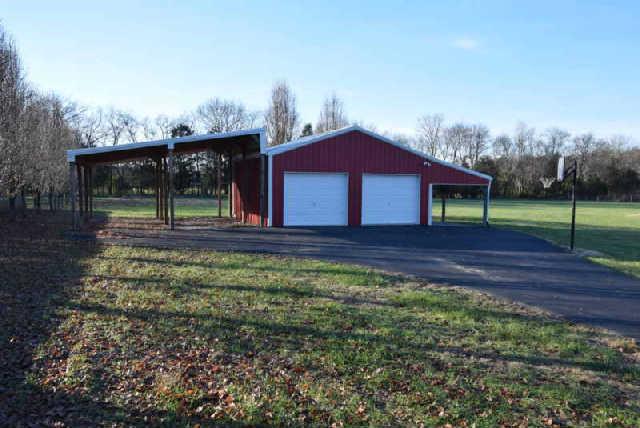 888 Locust Grove Road Watertown, TN 37184 - Photo 19 of 20 Extra sheds on either side of the garage would be perfect for boat and RV storage.