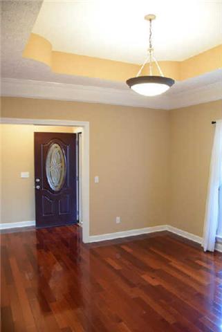 888 Locust Grove Road Watertown, TN 37184 - Photo 6 of 20 The dining room features a decorative trey ceiling and updated light fixtures. You'll love the beautiful hardwood floors that are throught the main areas of the home. Carpet in the bedrooms.